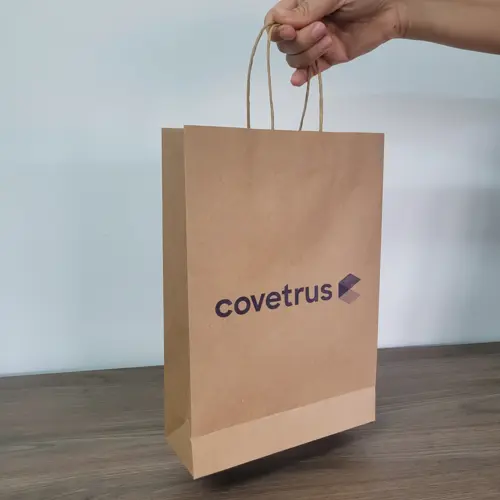 Covetrus — Sacola kraft com alça torcida