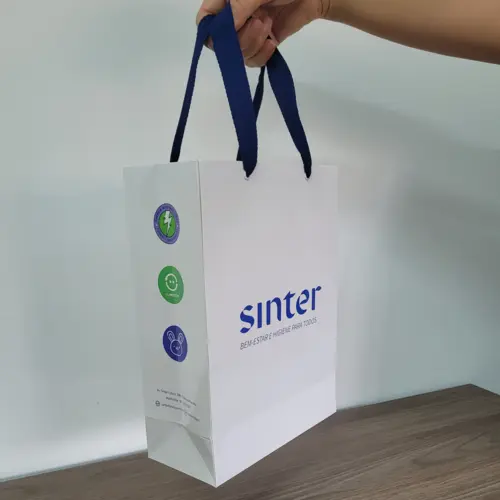 Sinter — Sacola branca com alça azul